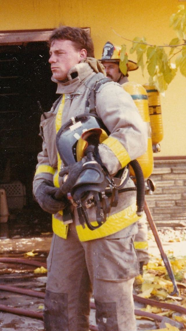 A young Walt White in turnout gear after a fire