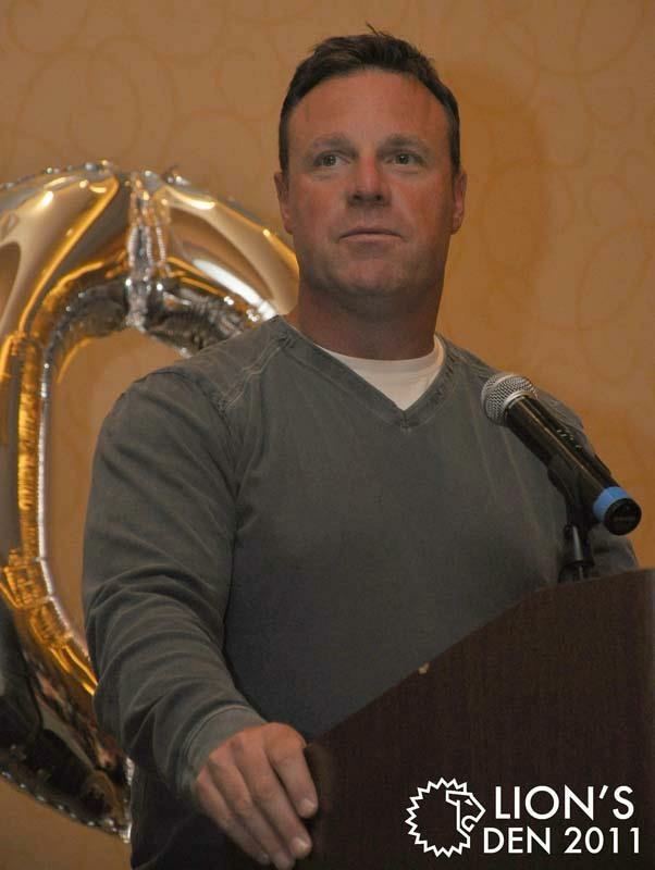 Walt White speaking at a podium